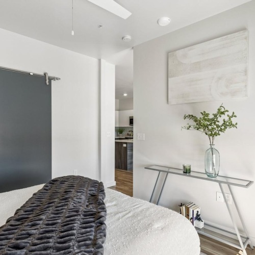 a bedroom with a bed and a table