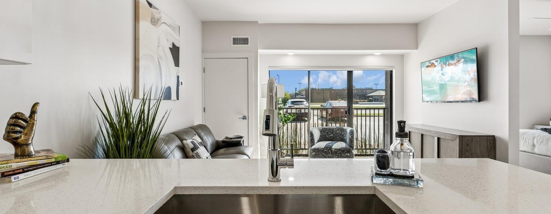 a large living room with a large glass table