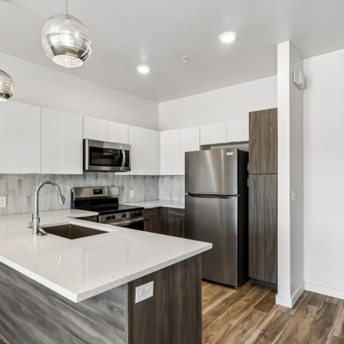 a kitchen with a marble island