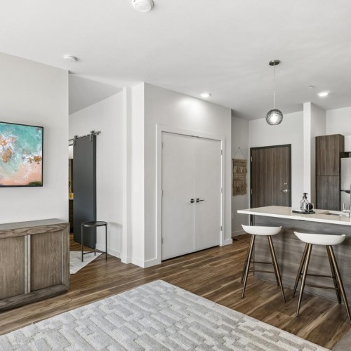 a kitchen with a dining table and couches